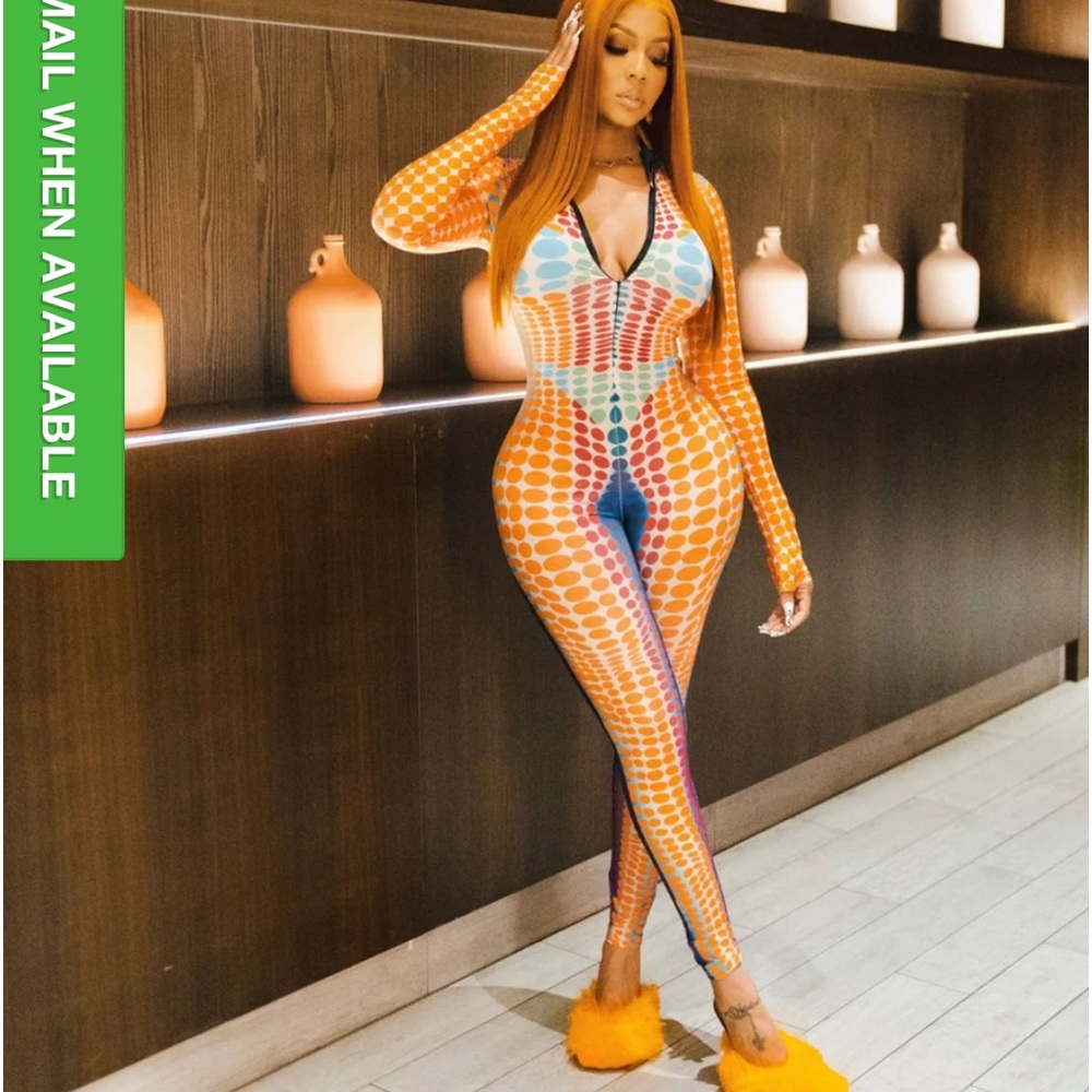 From Britt: body suit dotted ginger snaps. Beautiful full long sleevesBRAND NEW